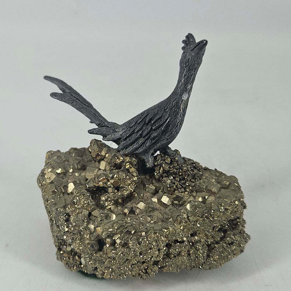 Vintage pewter roadrunner figurine on natural Pyrite nugget fool's gold crystal